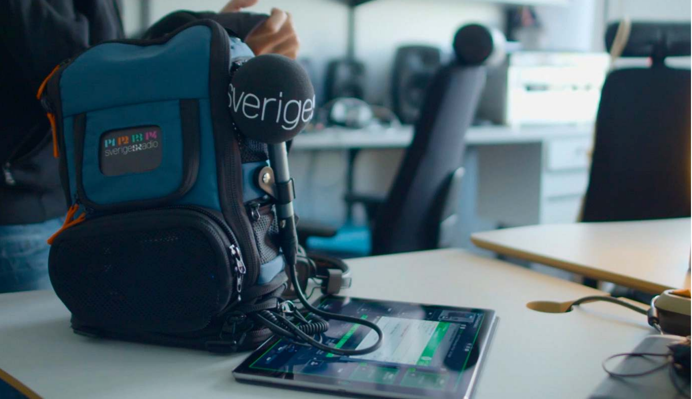 Sveriges Radio field kit: branded backpack, mic and a tablet running the touch interface